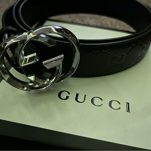 Gucci black leather belt.